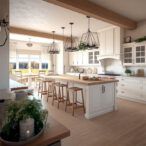 white kitchen cabinets with modern wood element